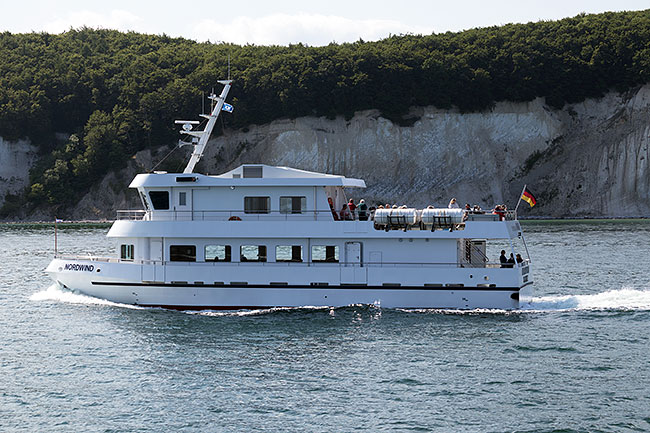 Encounter with a small excursion ship from Sassnitz in front of the chalk cliffs
