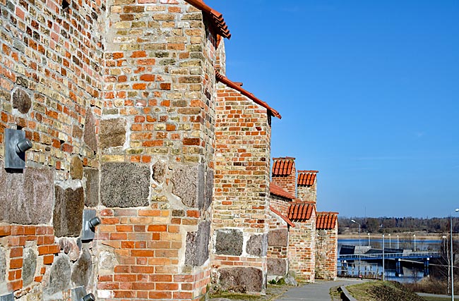 Rostock - Behind St. Peter's Church, the historic city wall ends, with the Warnow River flowing in the background