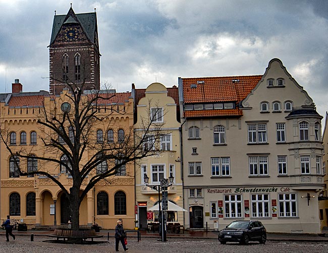 Wismar - Behind the main guardhouse, the west tower of St. Mary's Church rises into the sky
