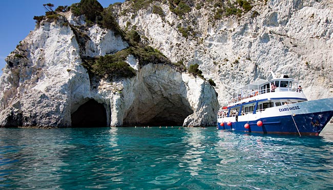 Zakynthos, the Ionian Island in Greece  - One of the larger excursion ships during a swimming stop in front of the caves on the island of Marathonissi